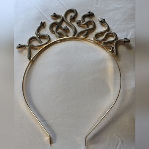 Gold tone snake headband with jewelled eyes